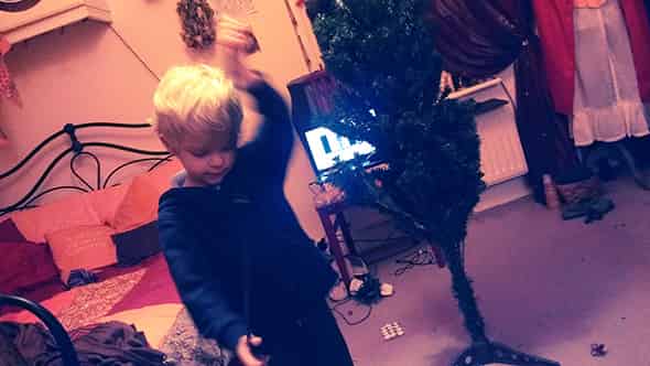 Lucien dressing the Christmas tree.