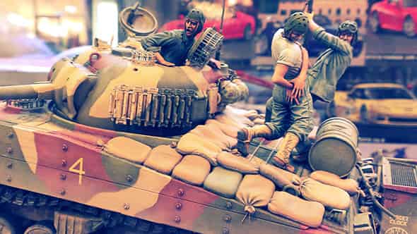 Model tank scene where one crewman is being shot in the ass.