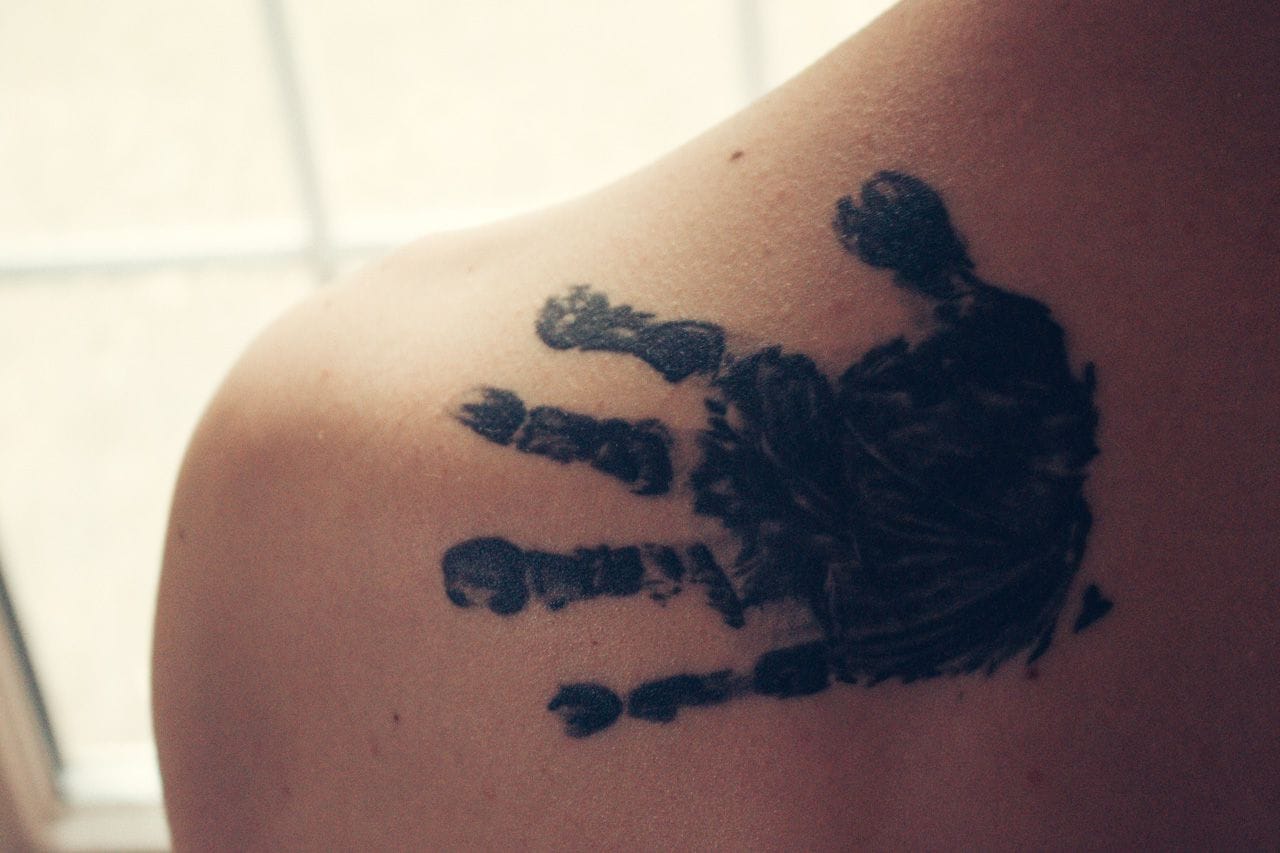 Lucien's hand on my left shoulder.